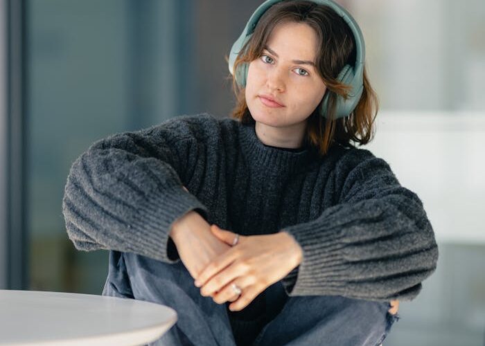 casual-young-woman-with-headphones-in-modern-space-29179701